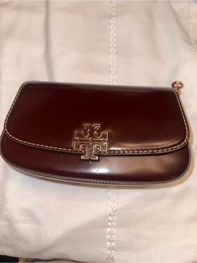 Tory Burch glossy dark brown leather clutch with gold logo